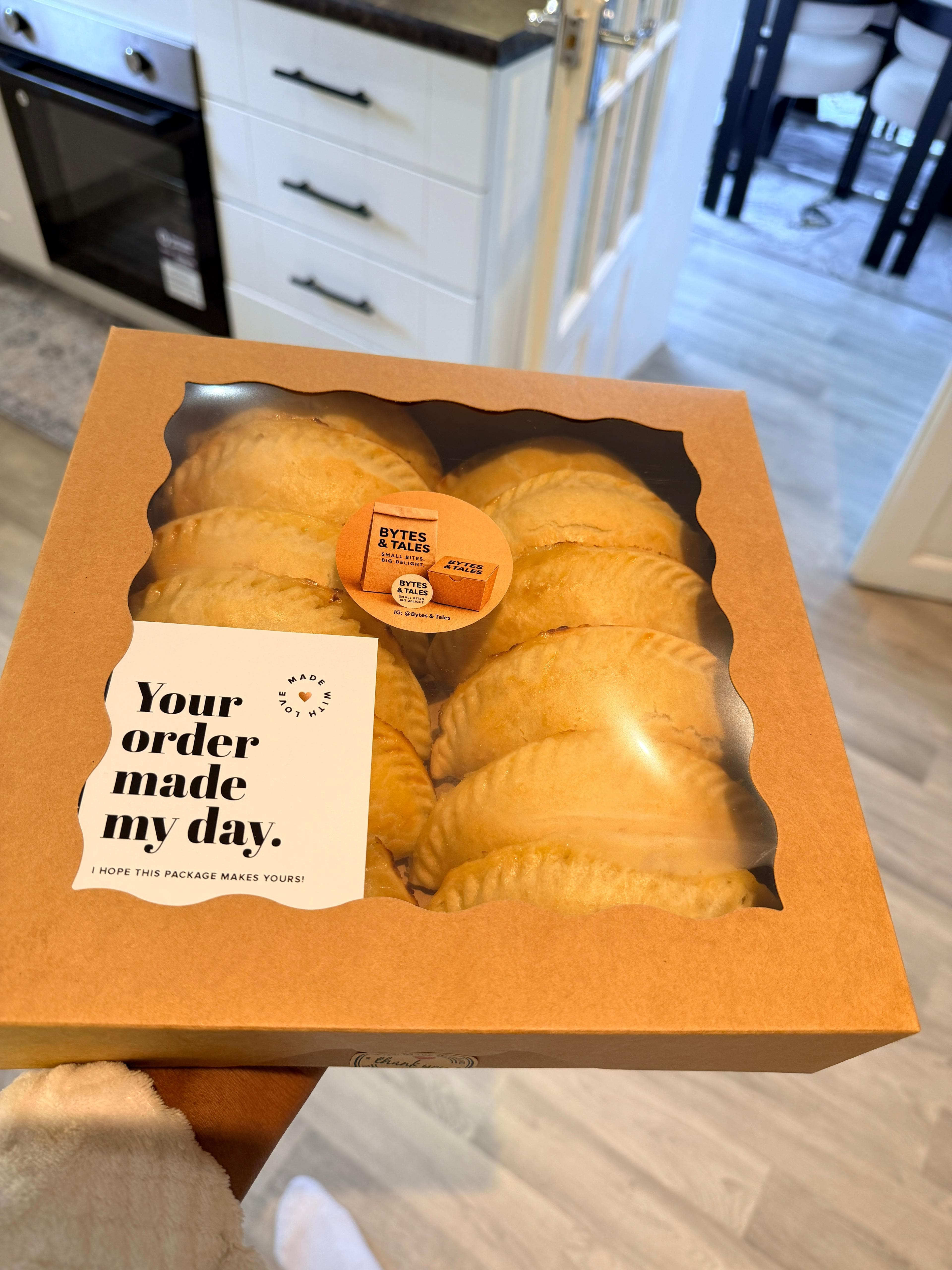 A box of golden Bytes & Tales meat pies, fresh from the oven